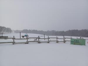 雪が降っているときの見晴らしまきばの写真